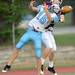 Skyline senior Alex Belanger and Dexter senior Erik Skiver reach for a pass intended for Skiver during the first half at Dexter on Friday night.